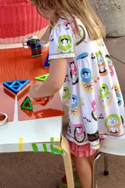 Girl playing with Magformers