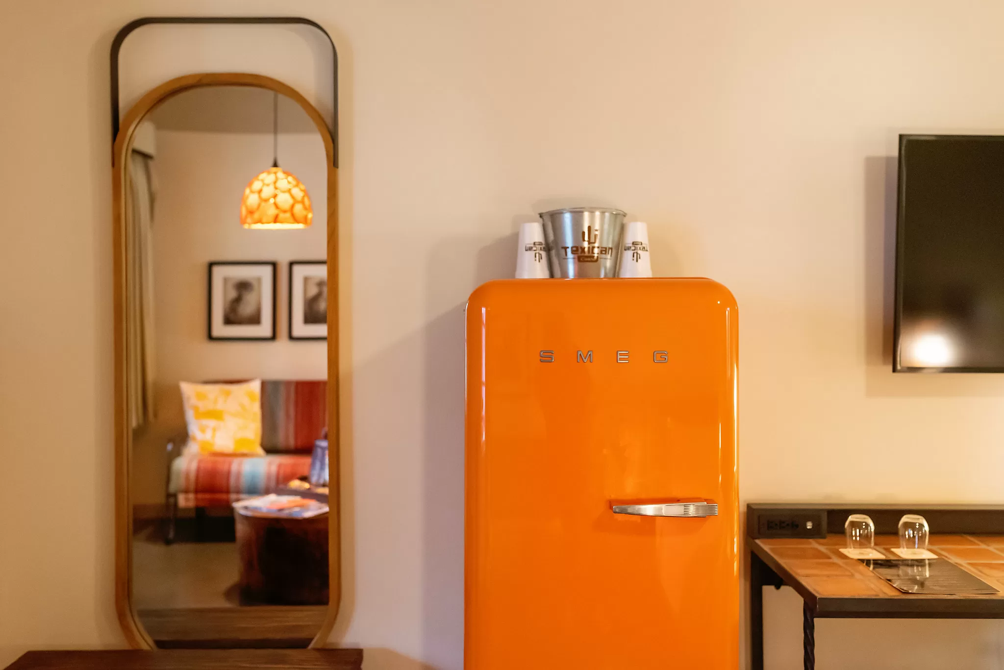 Orange SMEG refrigerator in a guestroom at the Texican Court Hotel