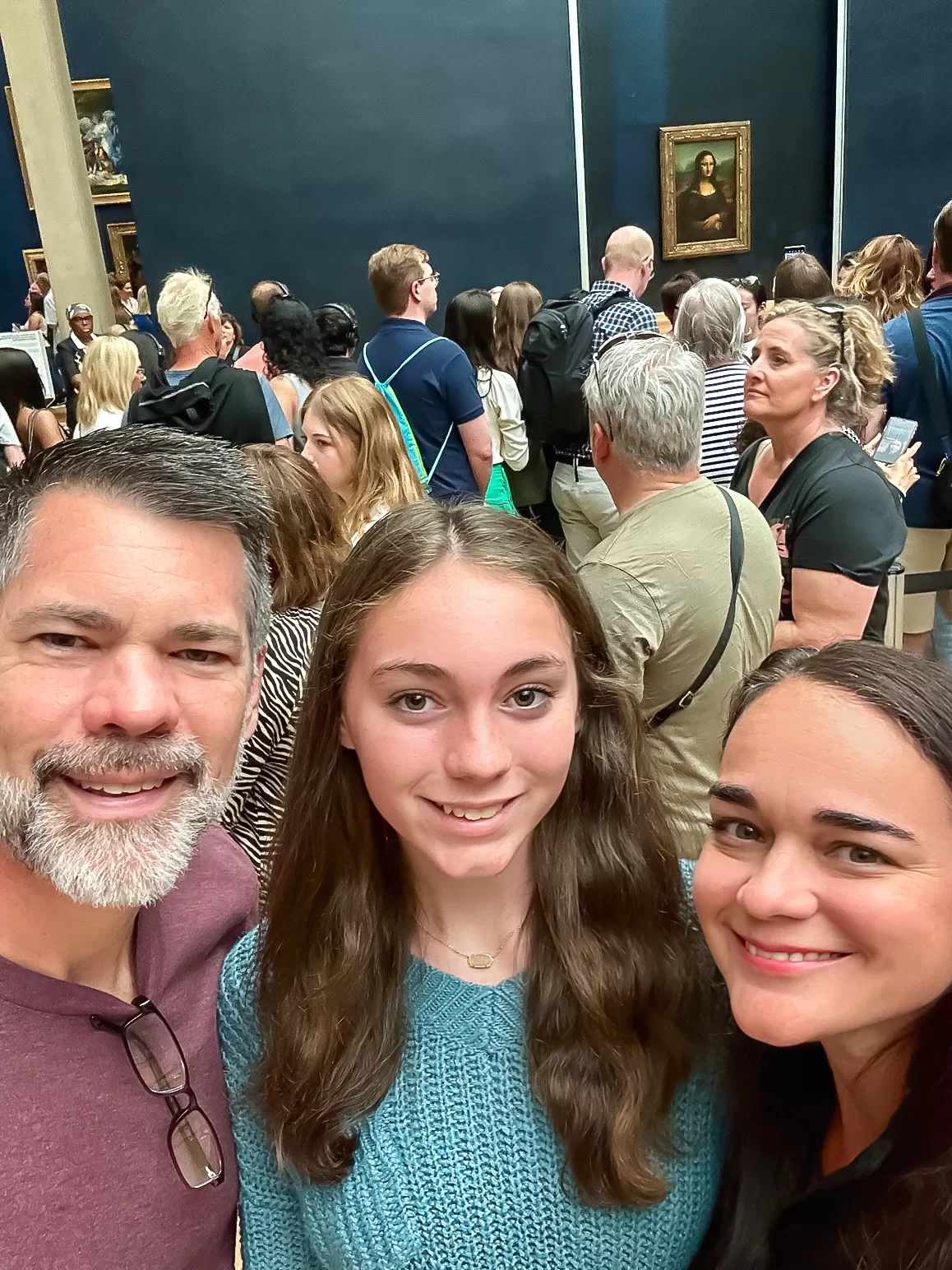 is the mona lisa worth it? Photos of a family at the mona lisa
