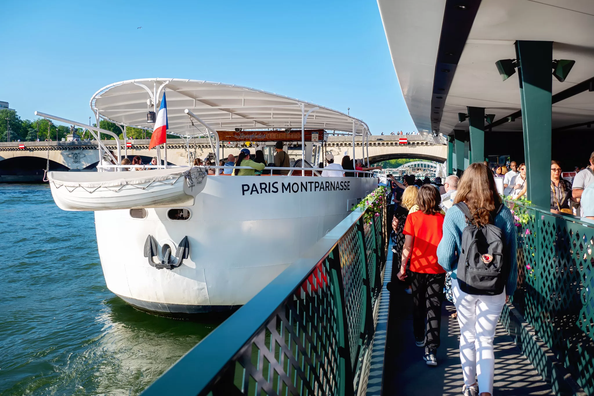 Boarding a Vedettes de Paris boat cruise. 