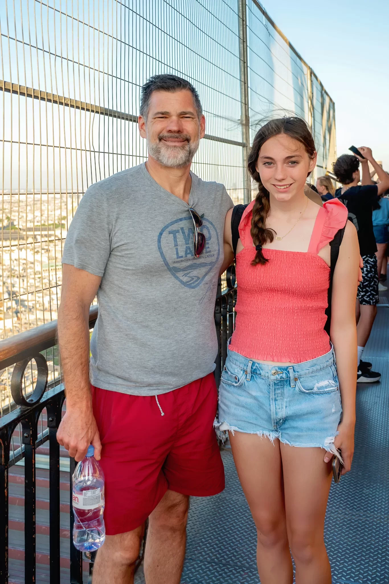 Dad and Daughter at the 2nd floor of the Eiffel Tower at sunset