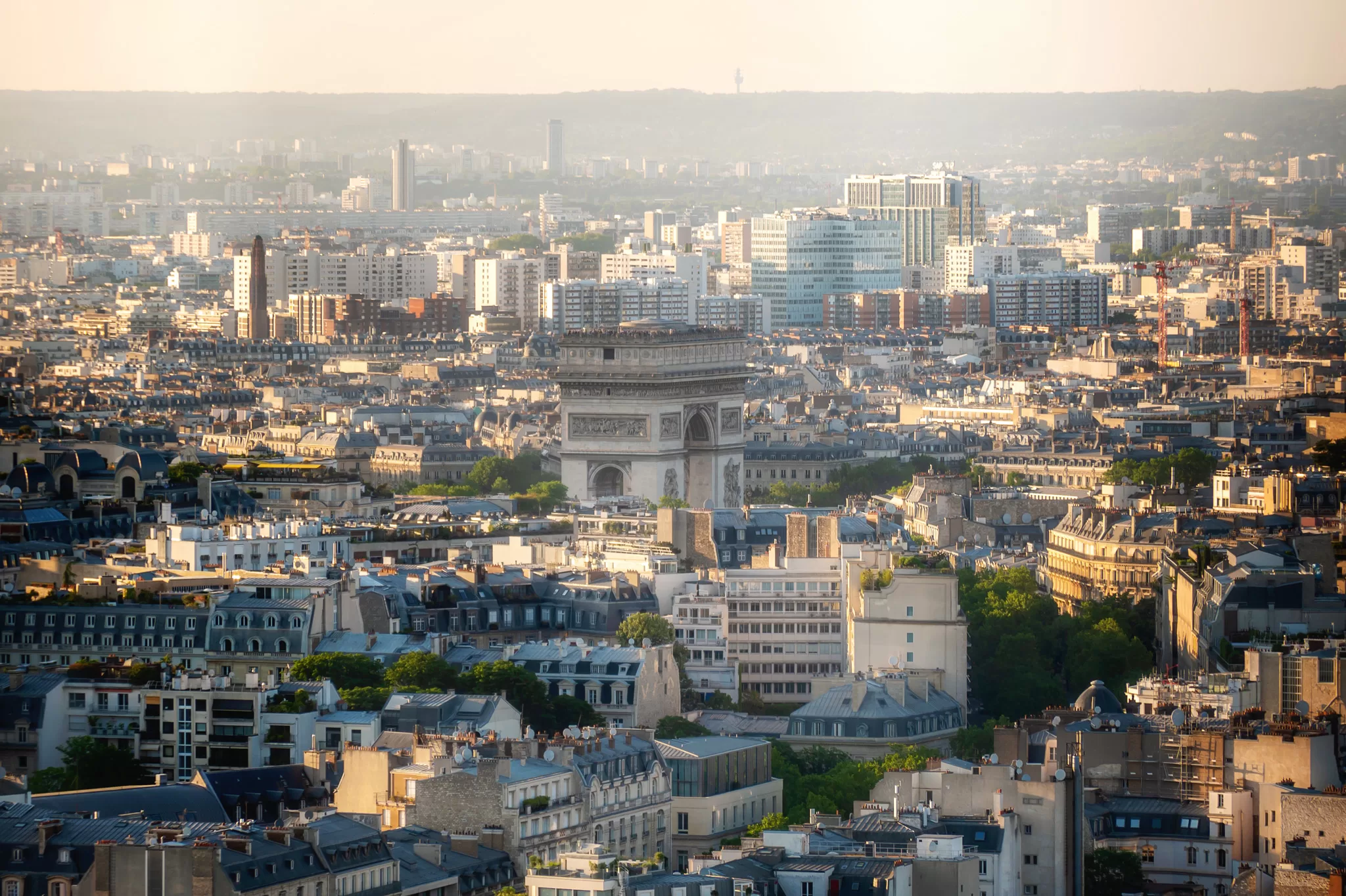 Photo of Arc de Triumph and Paris taken from the 2nd floor of the Eiffel Tower at sunset