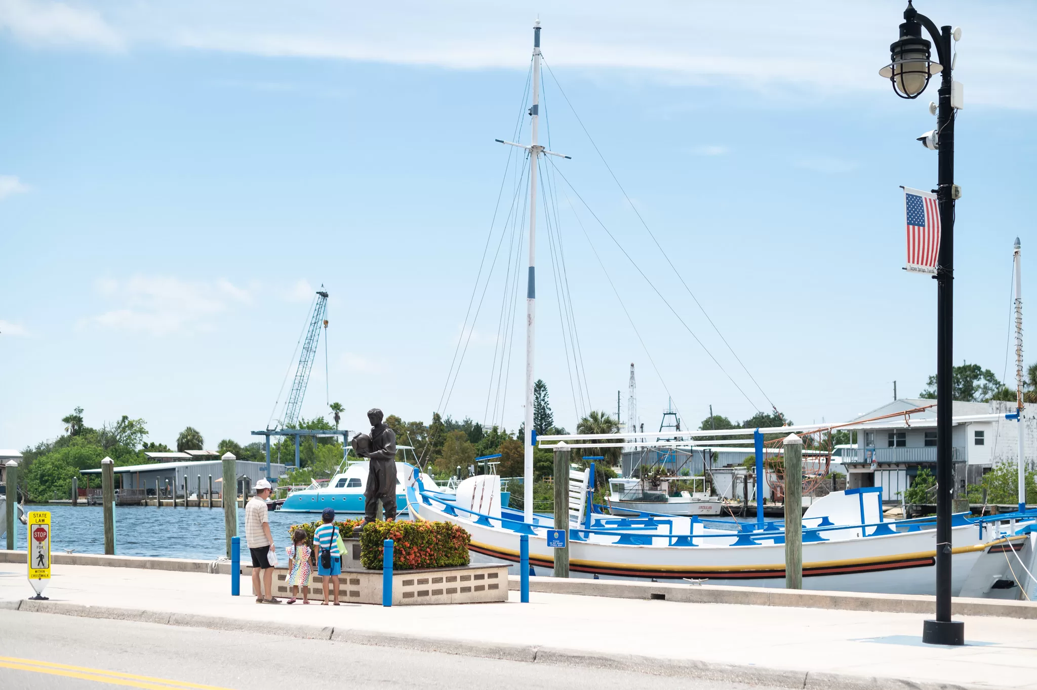 A family in downtown Tarpon Springs Florida.  This historic Greek coastal community is known for it's sponge docks. 