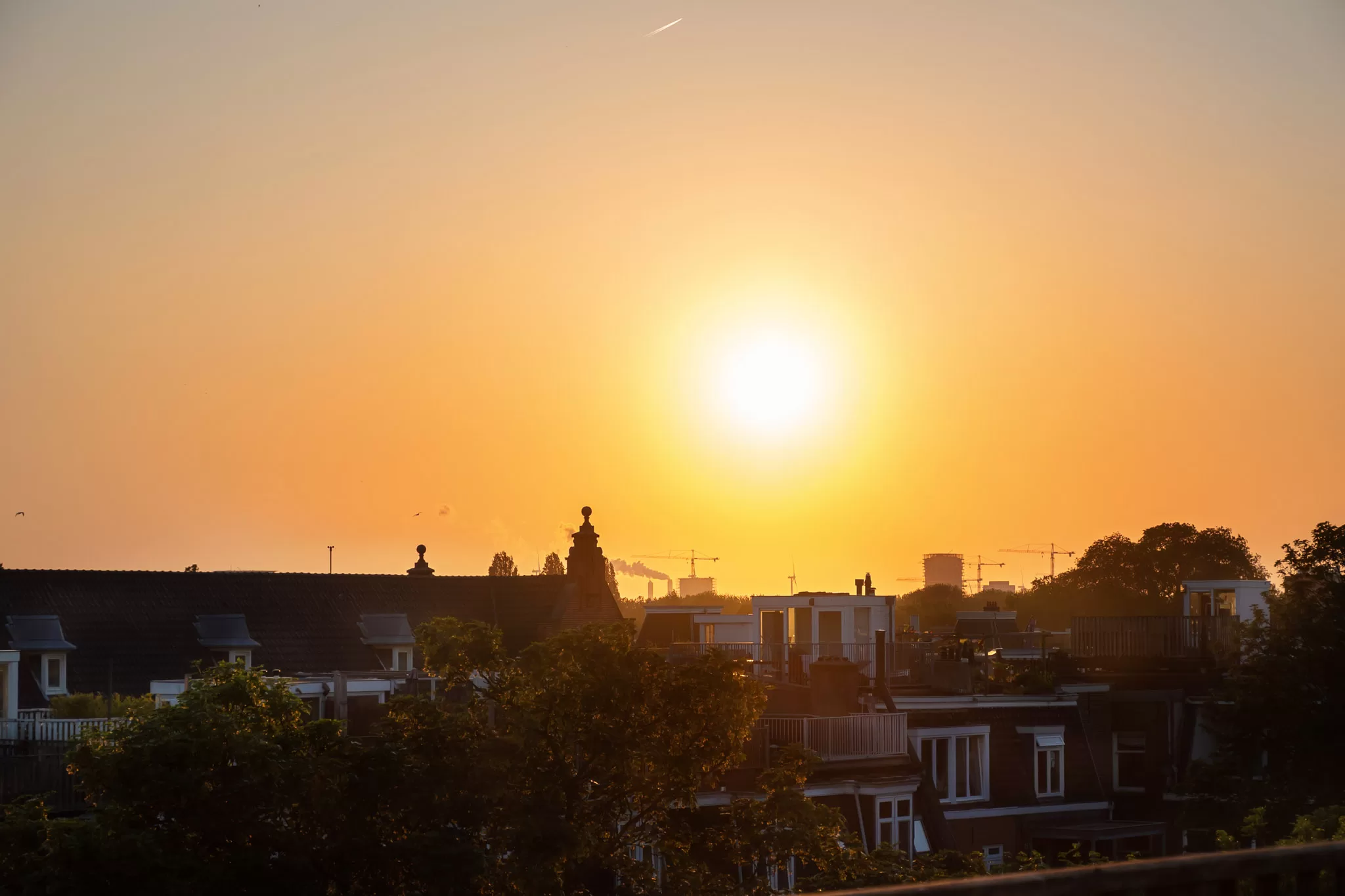 Sunset from an oud west rooftop in Amsterdam