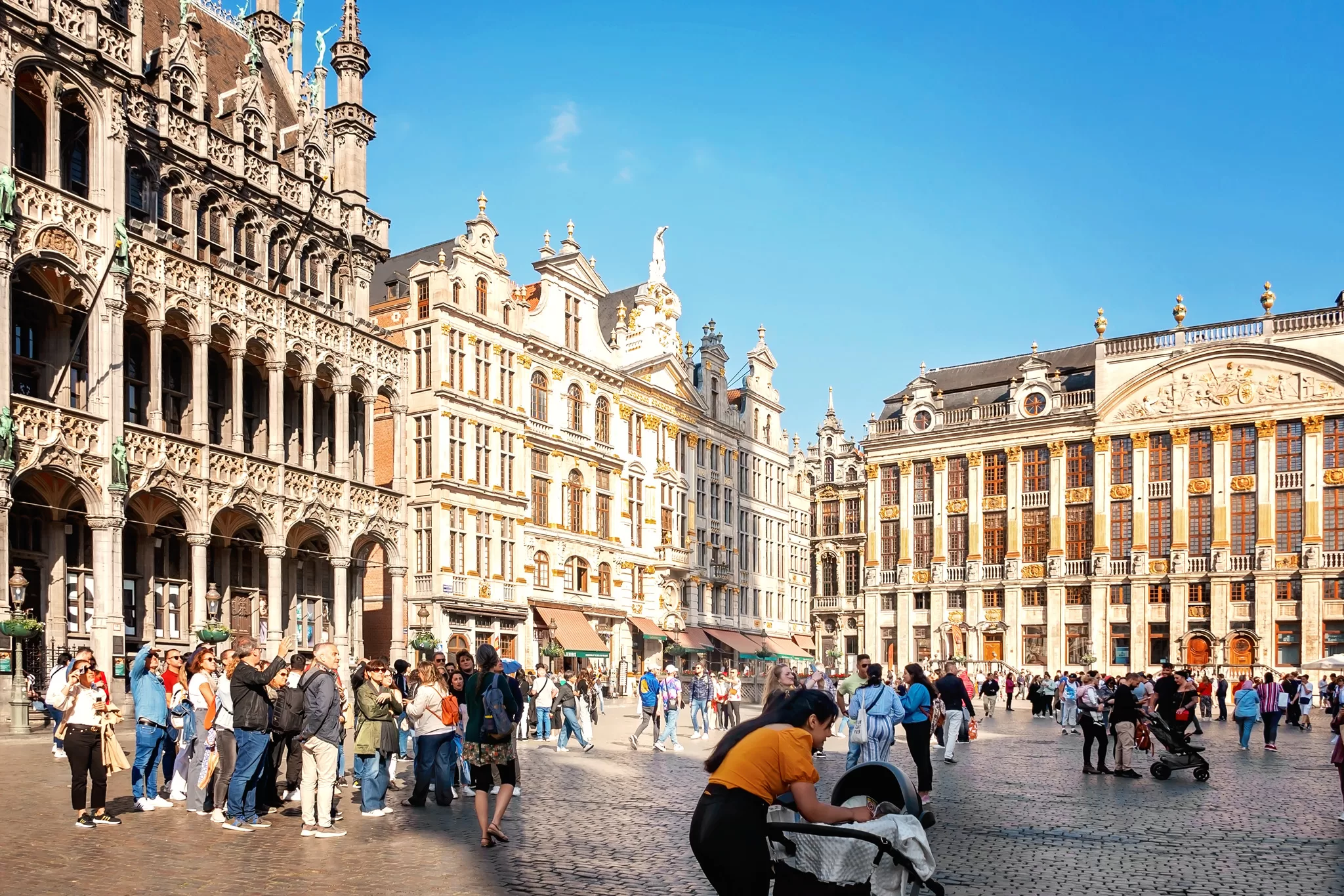 This image was taken during a weekend in Brussels.  You can see people strolling around Grand Place