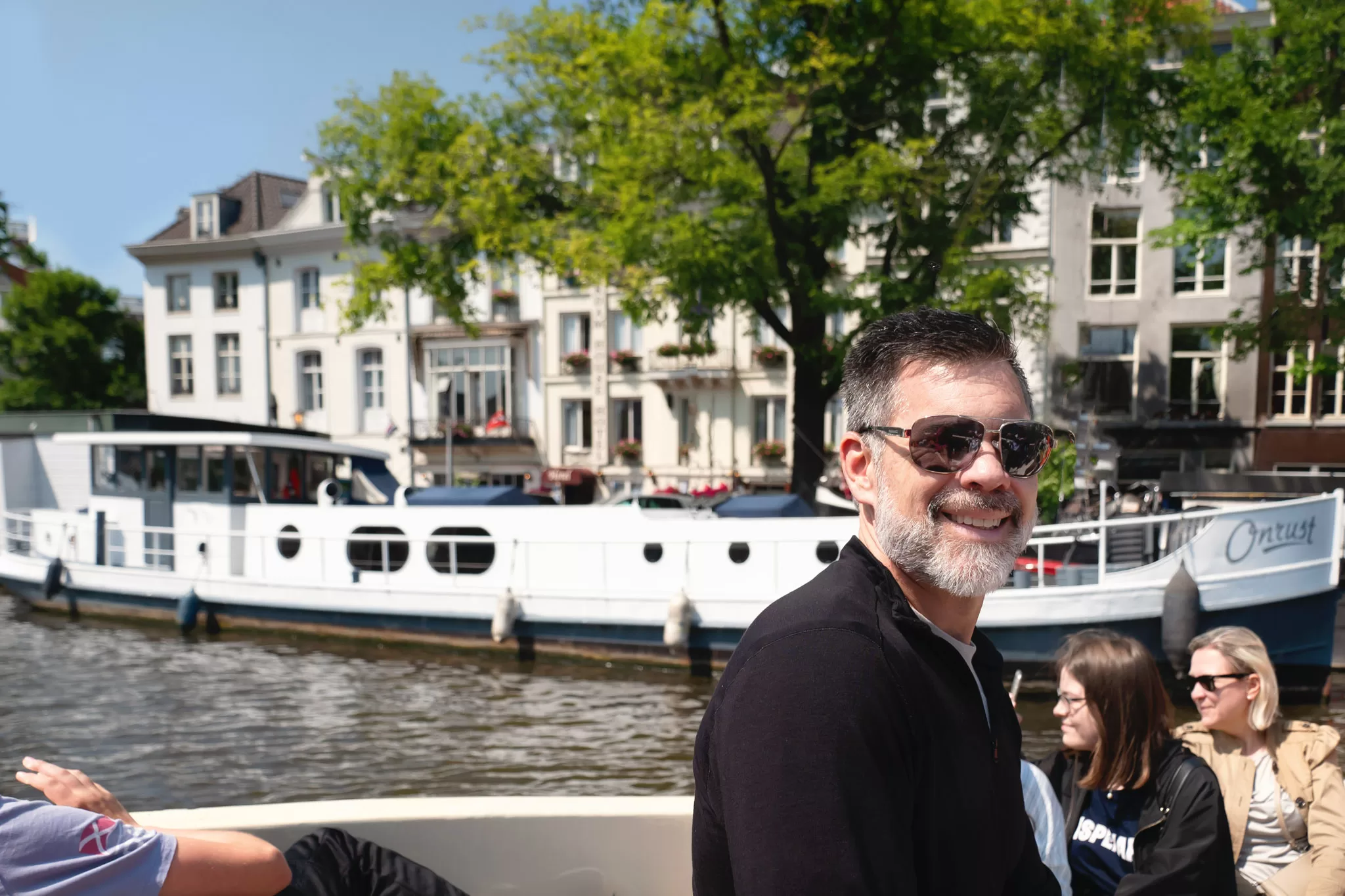 A Man on a Flagship Canal Tour of Amsterdam