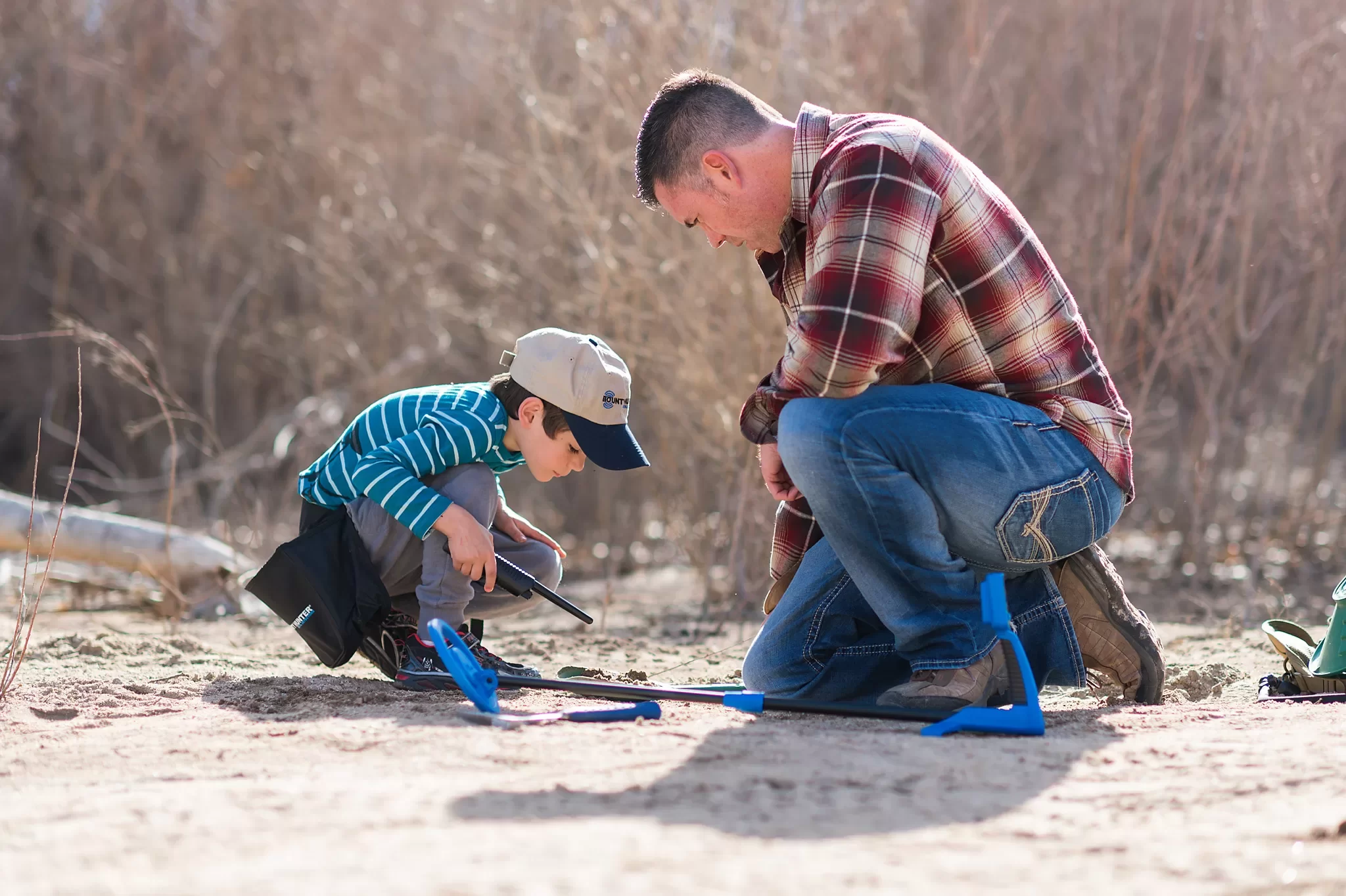 Boy Metal Detecting with his Dad