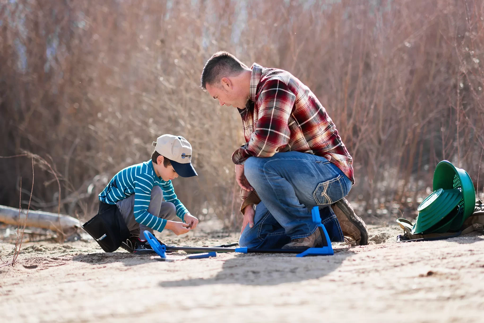 Boy Metal Detecting with Dad