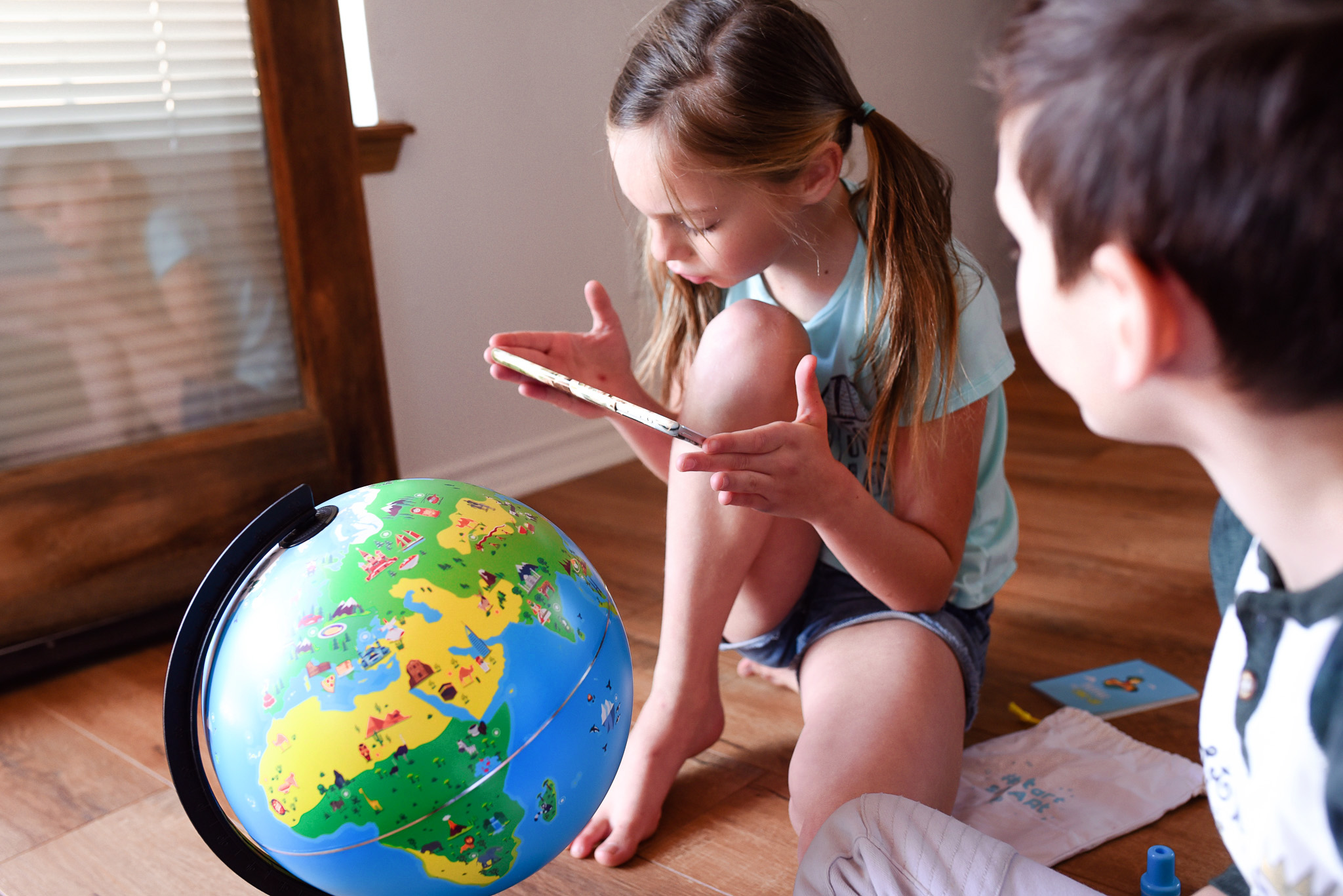 Kids playing with an Orboot globe