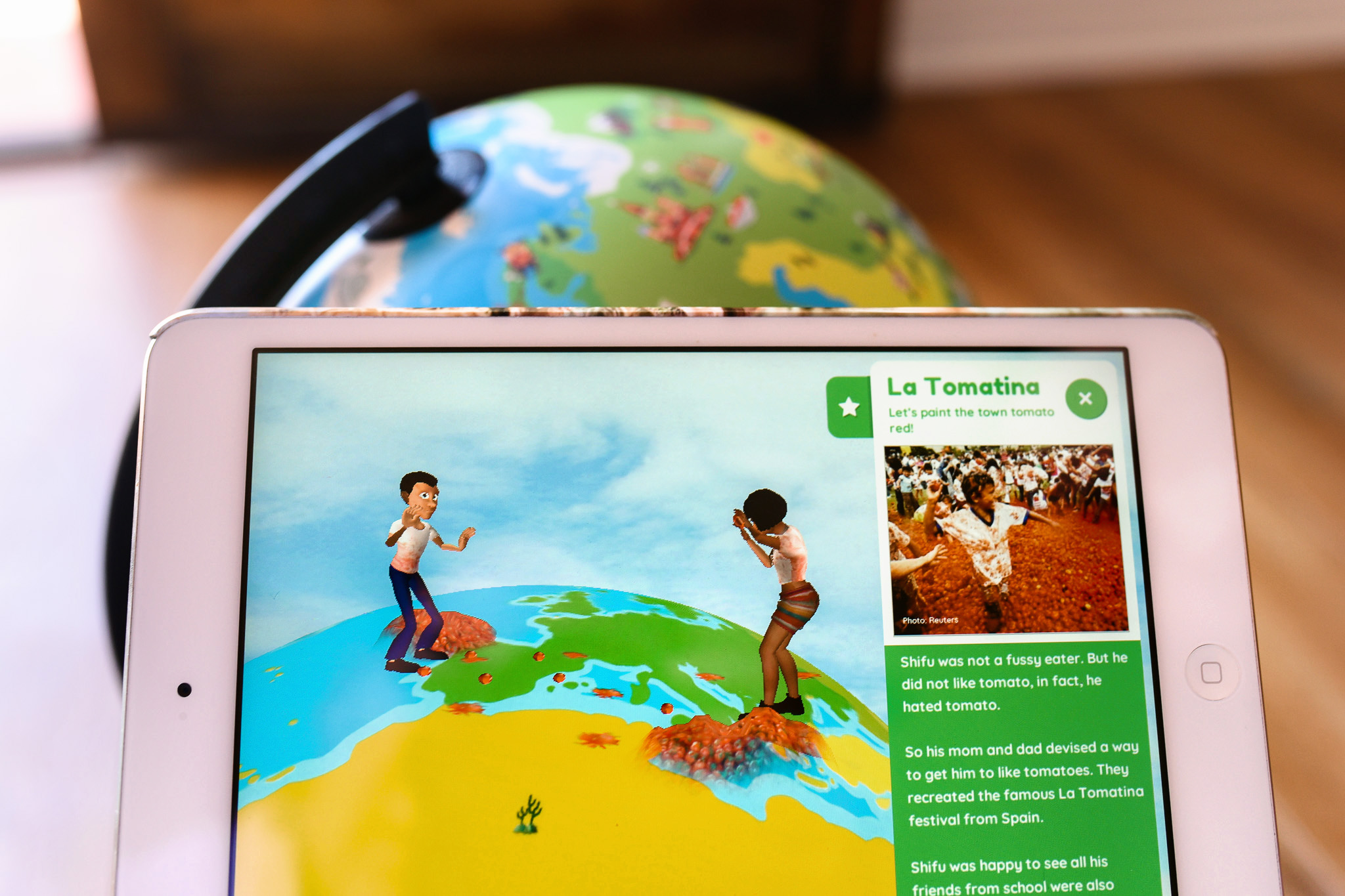 Orboot review - image shows the screen of an ipad learning about La Tomatina on the Orboot Interactive Globe