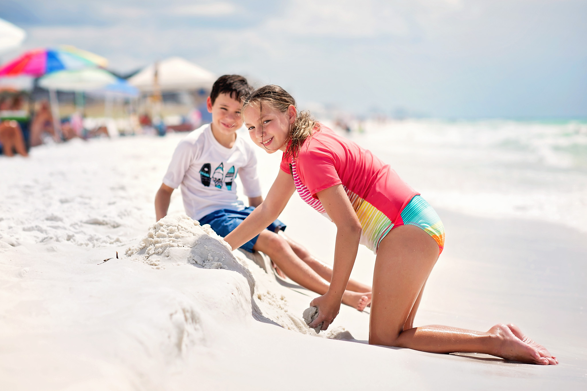 2 kids playing at the beach in the florida panhandle