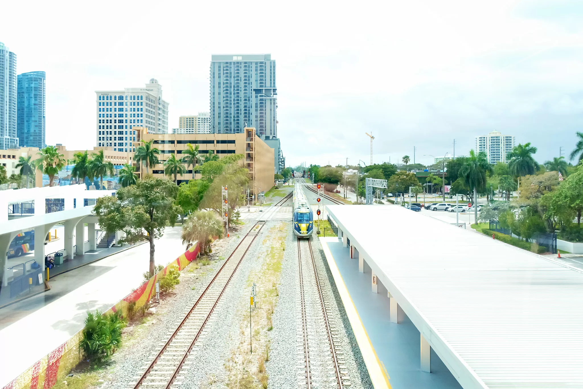 bright line train arriving at the station