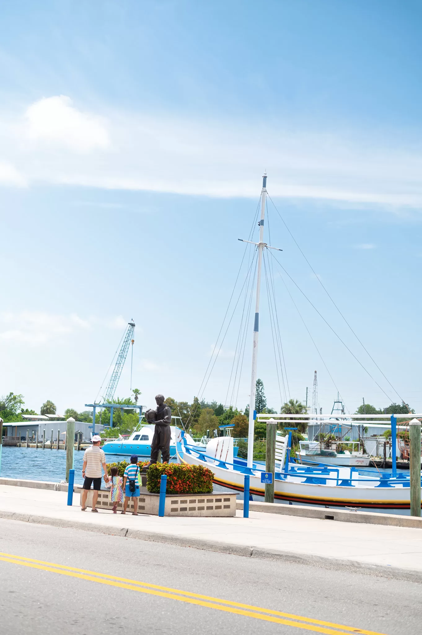 A family in downtown Tarpon Springs Florida. This historic Greek coastal community is known for it's sponge docks.