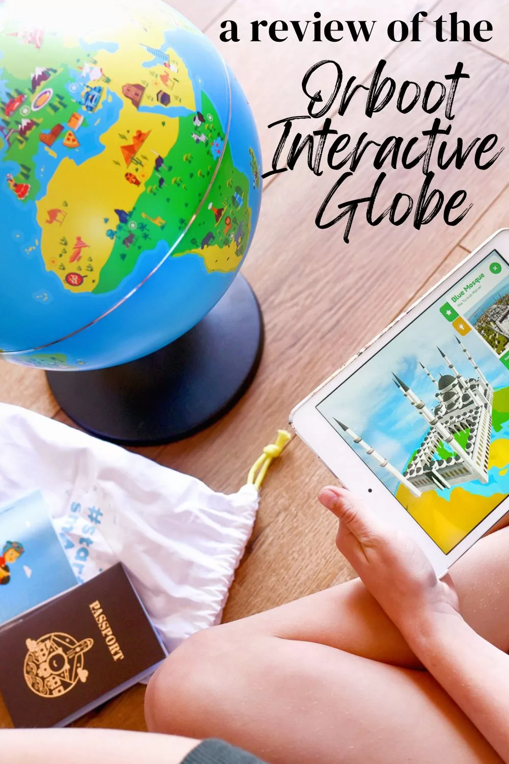 image shows a girl looking at the Orboot Educational Globe and the caption reads "a review of the Orboot Interactive Globe"