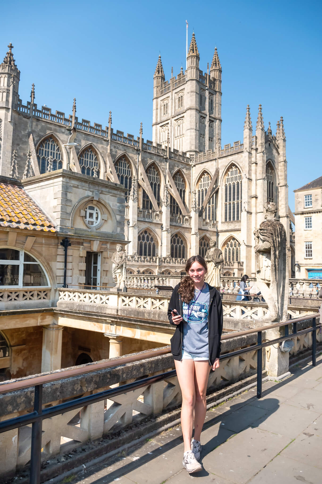 a girl at Bath Abbey and the Museum at the ancient roman baths in the United Kingdom