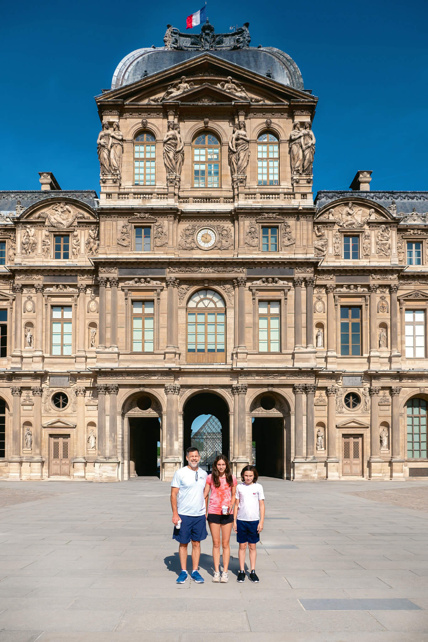 Family outside of the Louvre in Paris France