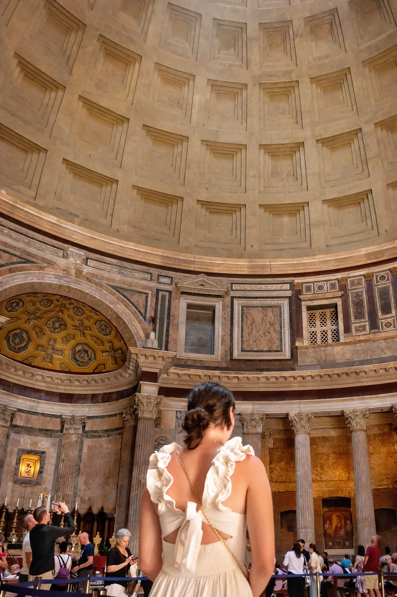 A teenage girl wearing a free people dress at the Pantheon Rome Italy