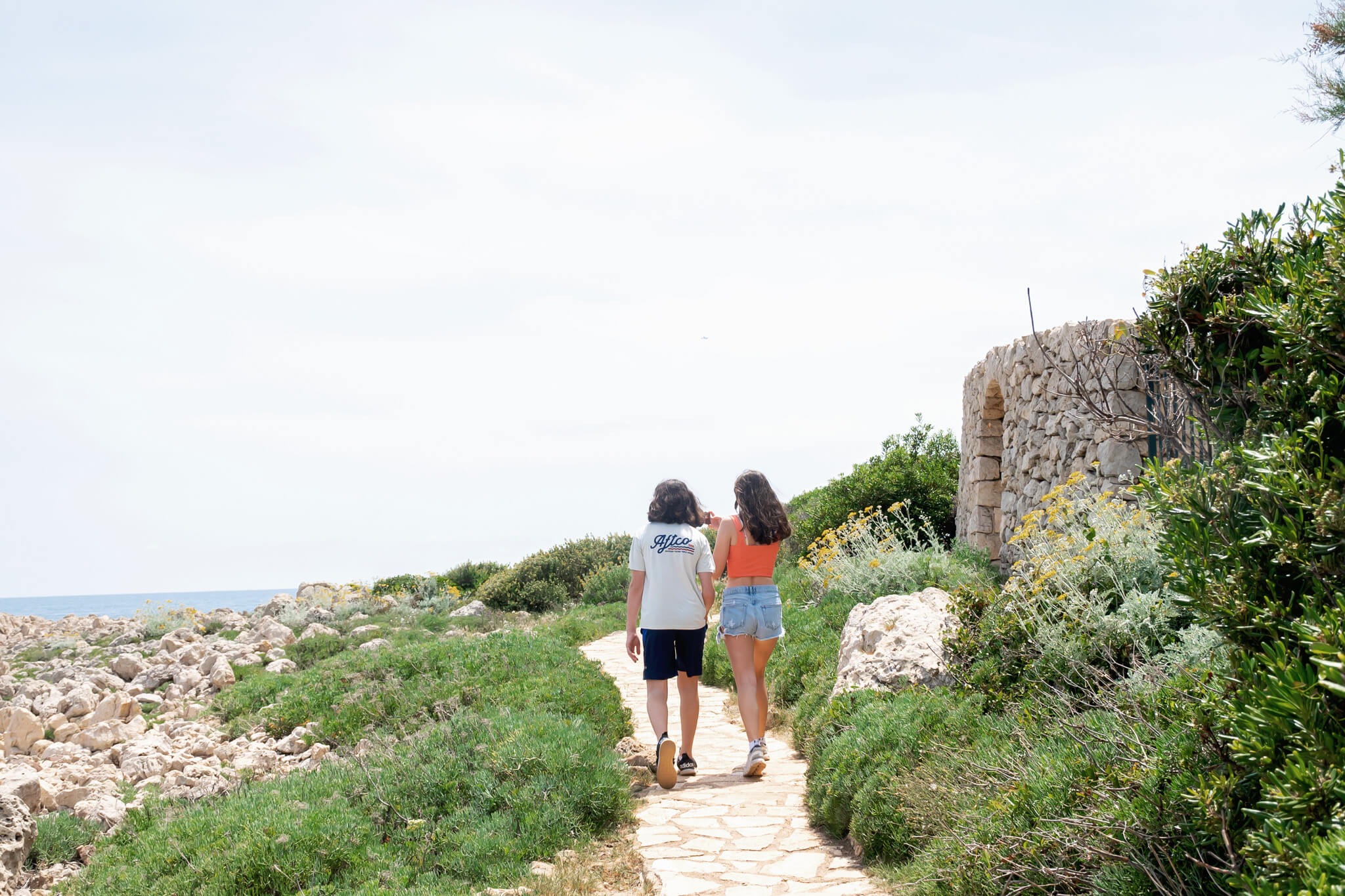 Tow kids on the walking bath along the Cap d'Antibes Hike in Antibes France