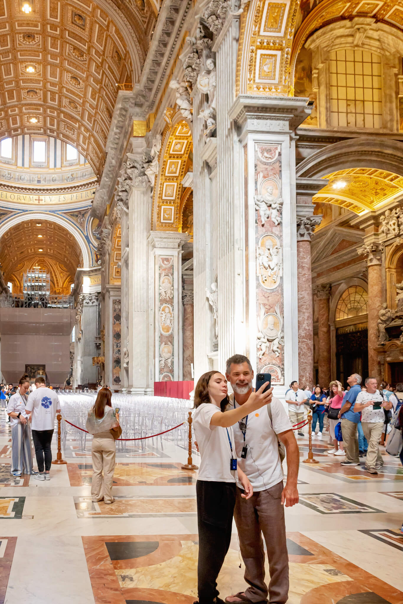 A father and son taking a selfie inside  of St Peters Basilica Vatican City Rome