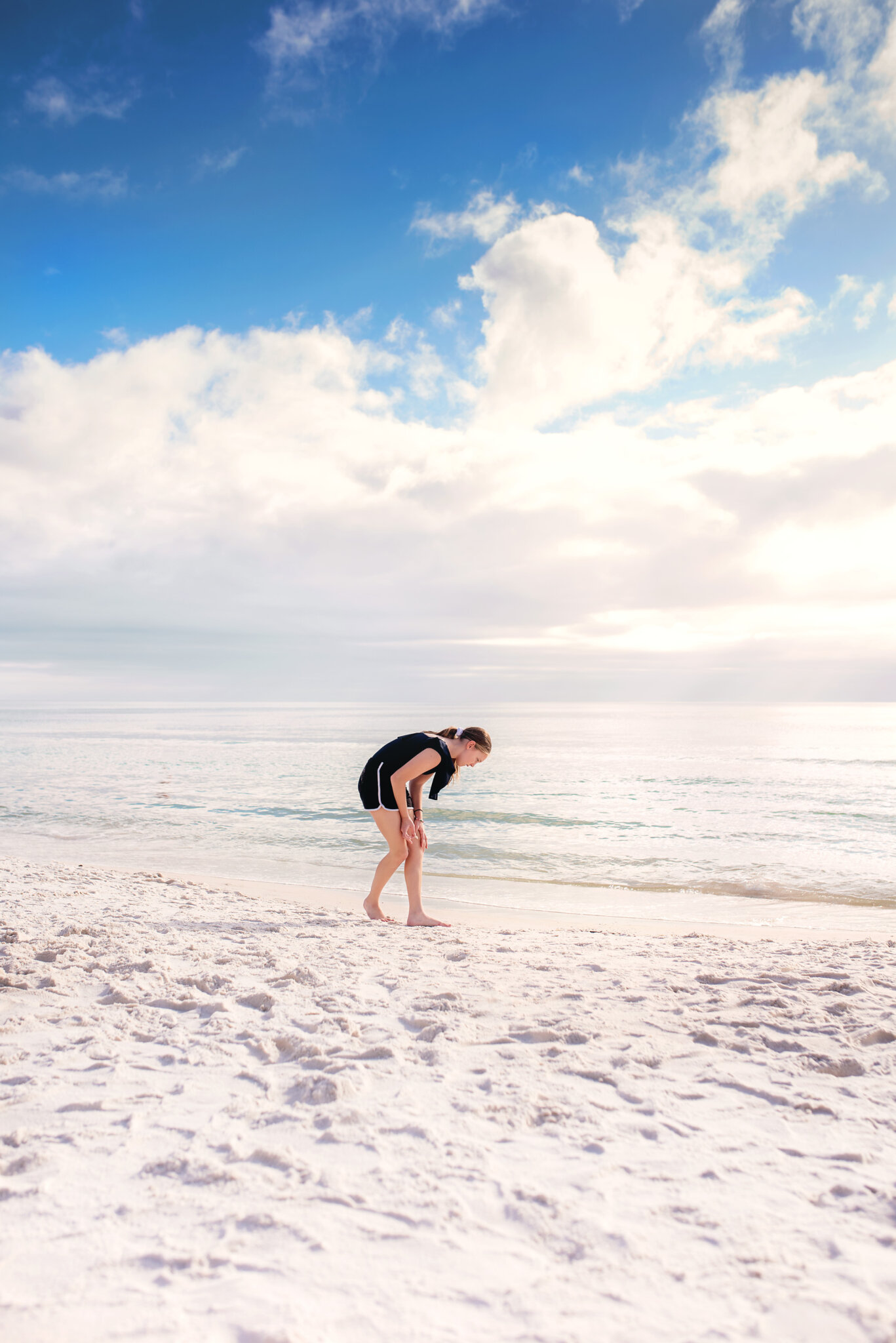 Winter on 30A and a girl looking for shells 