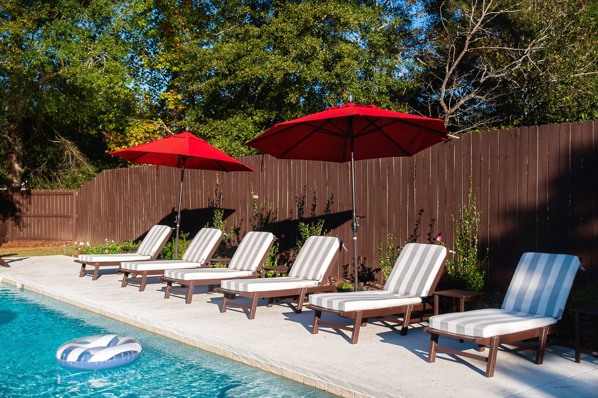 Backyard Furniture From Wayfair feat Polywood loungers and cushions