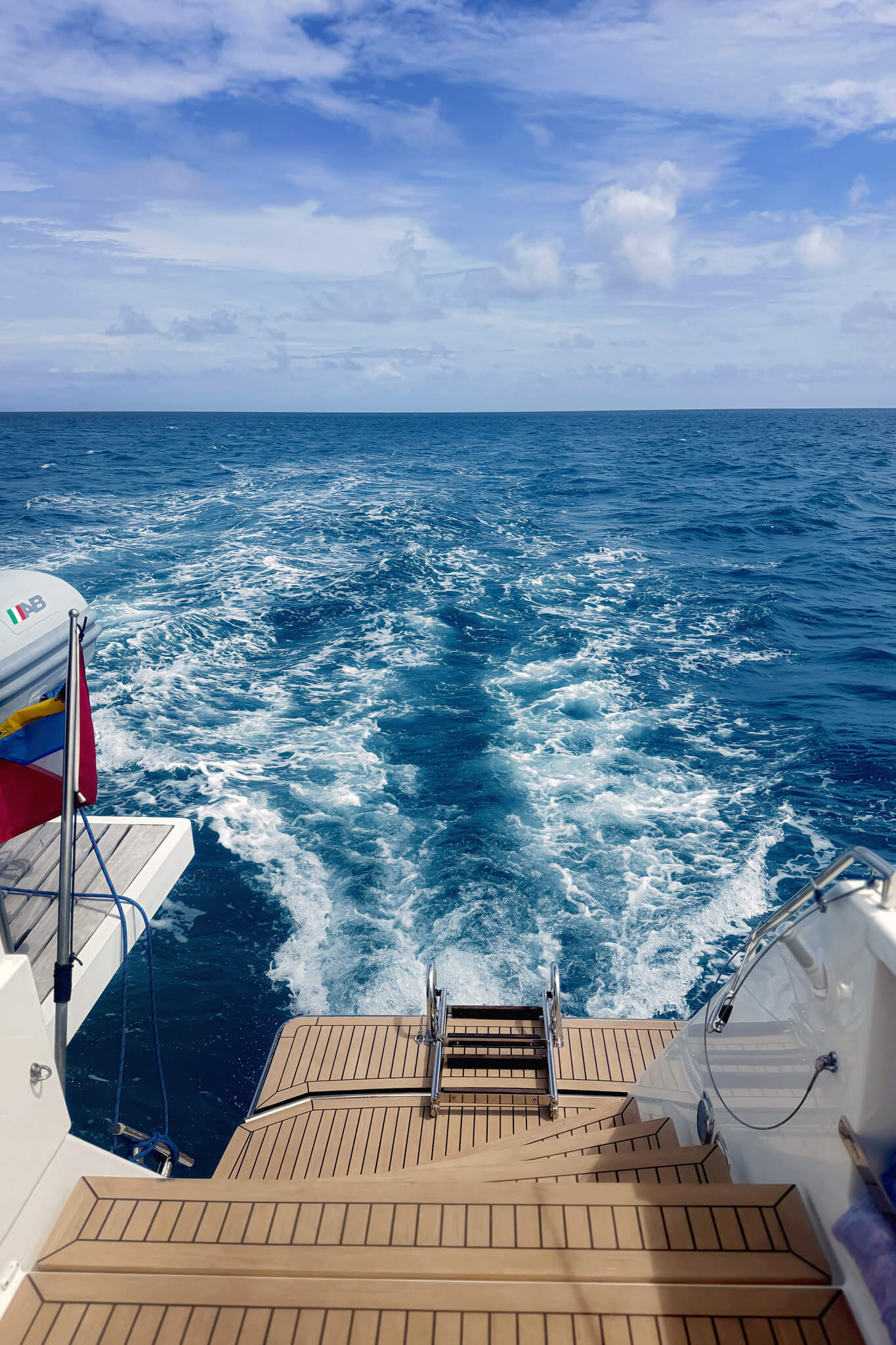 the blue Caribbean water near anitgua from the back of our catamaran