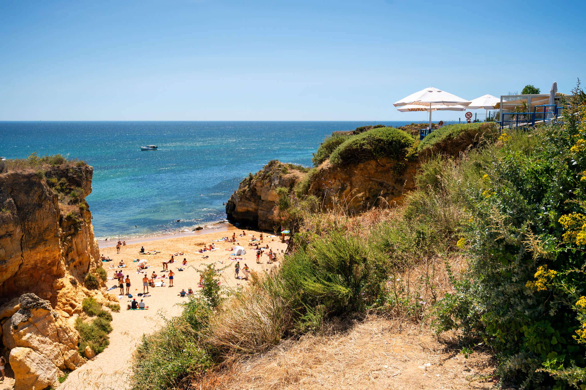 beach in Lagos Portugal with Mar restaurant above
