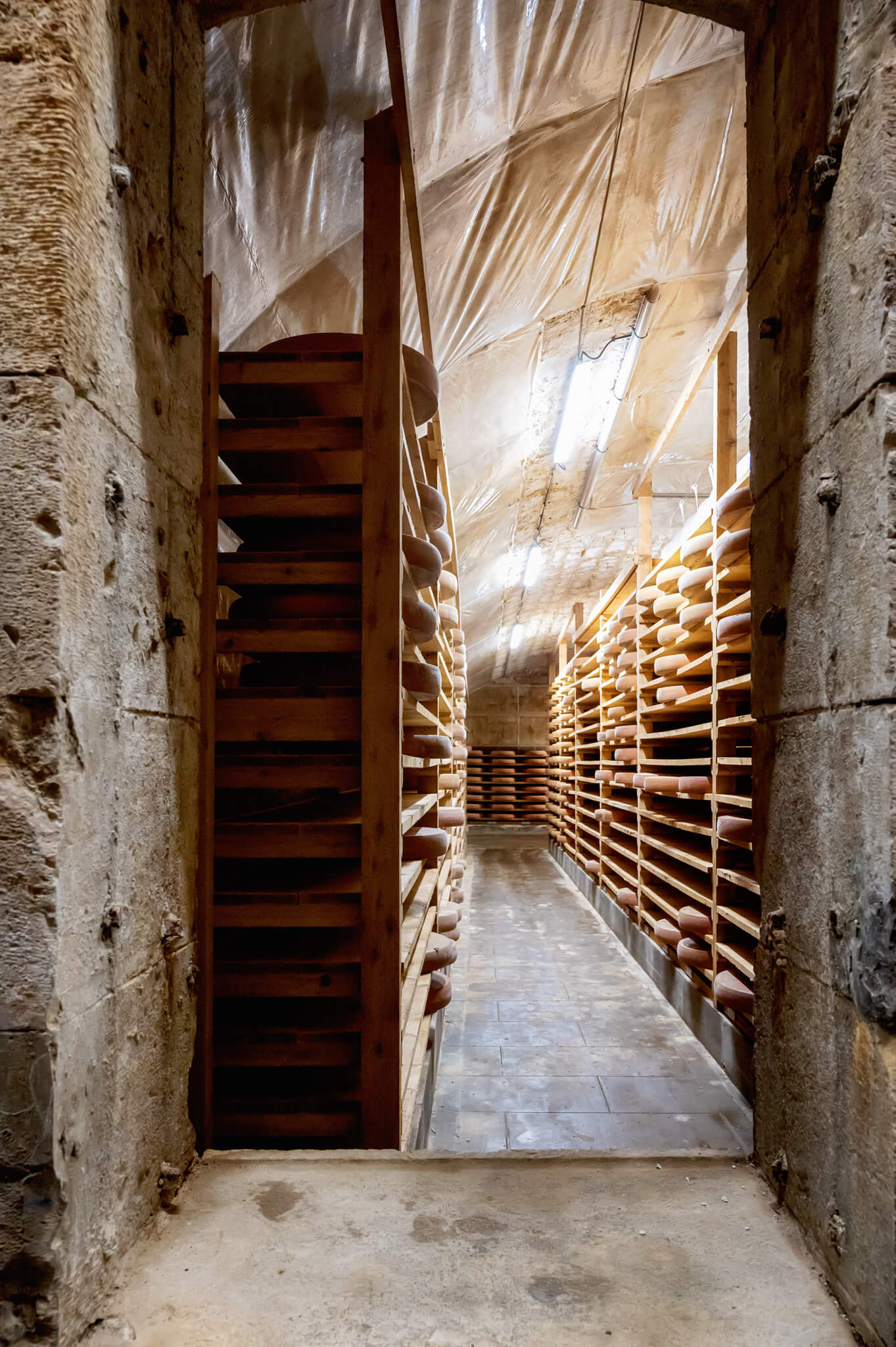 Narrow comte cellar aisle